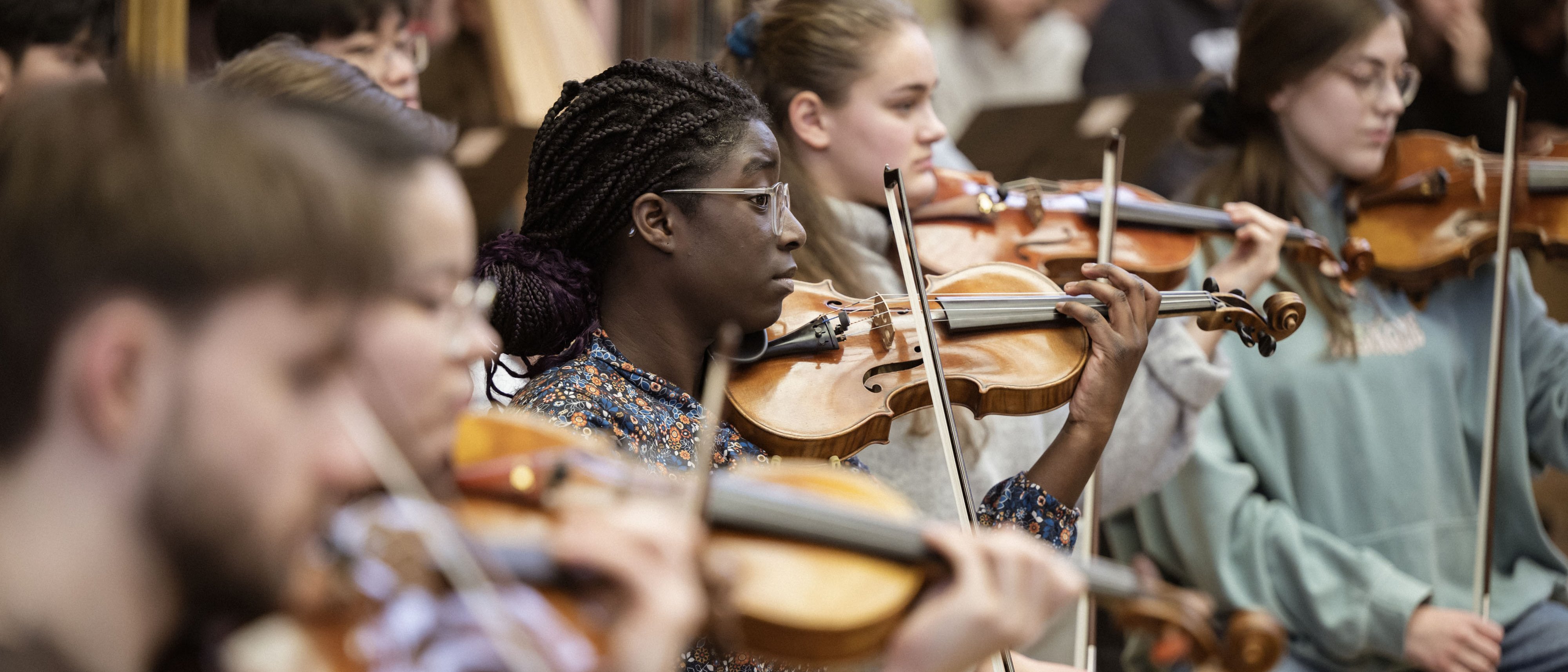 Young people making music with violins