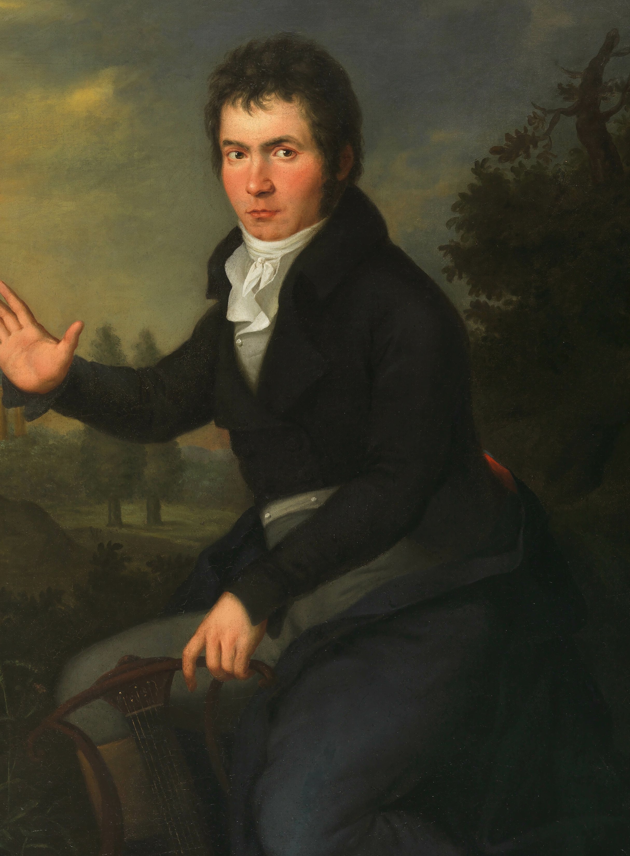 A classical oil painting of a seated man in dark formal attire with a white cravat, holding a lyre, gesturing with one hand, set against a scenic outdoor background, in an ornate gold frame.