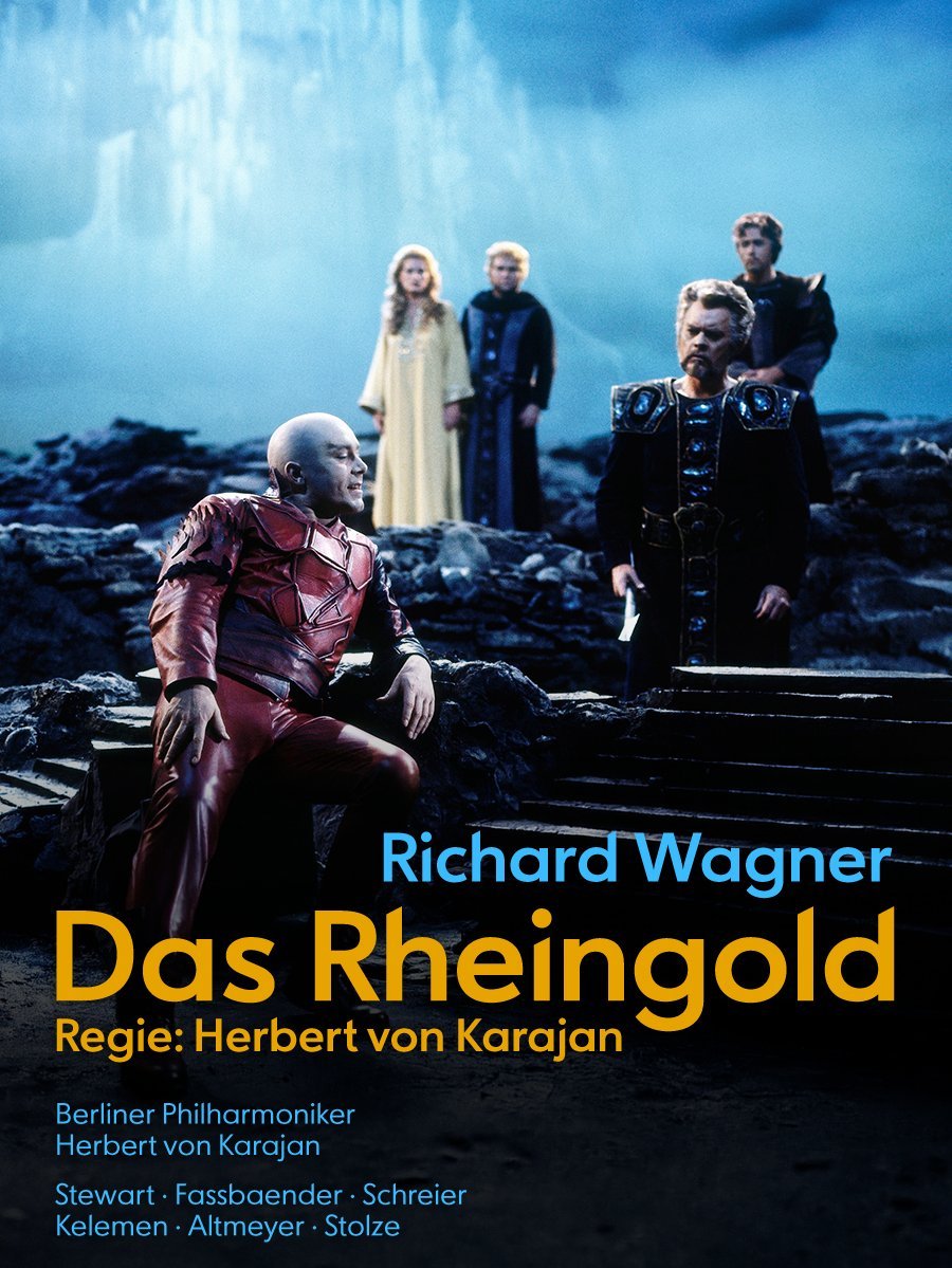 Five people in dramatic costumes stand on a rocky, foggy stage with blue light. Large text underneath reads: Richard Wagner Das Rheingold, Regie: Herbert von Karajan.