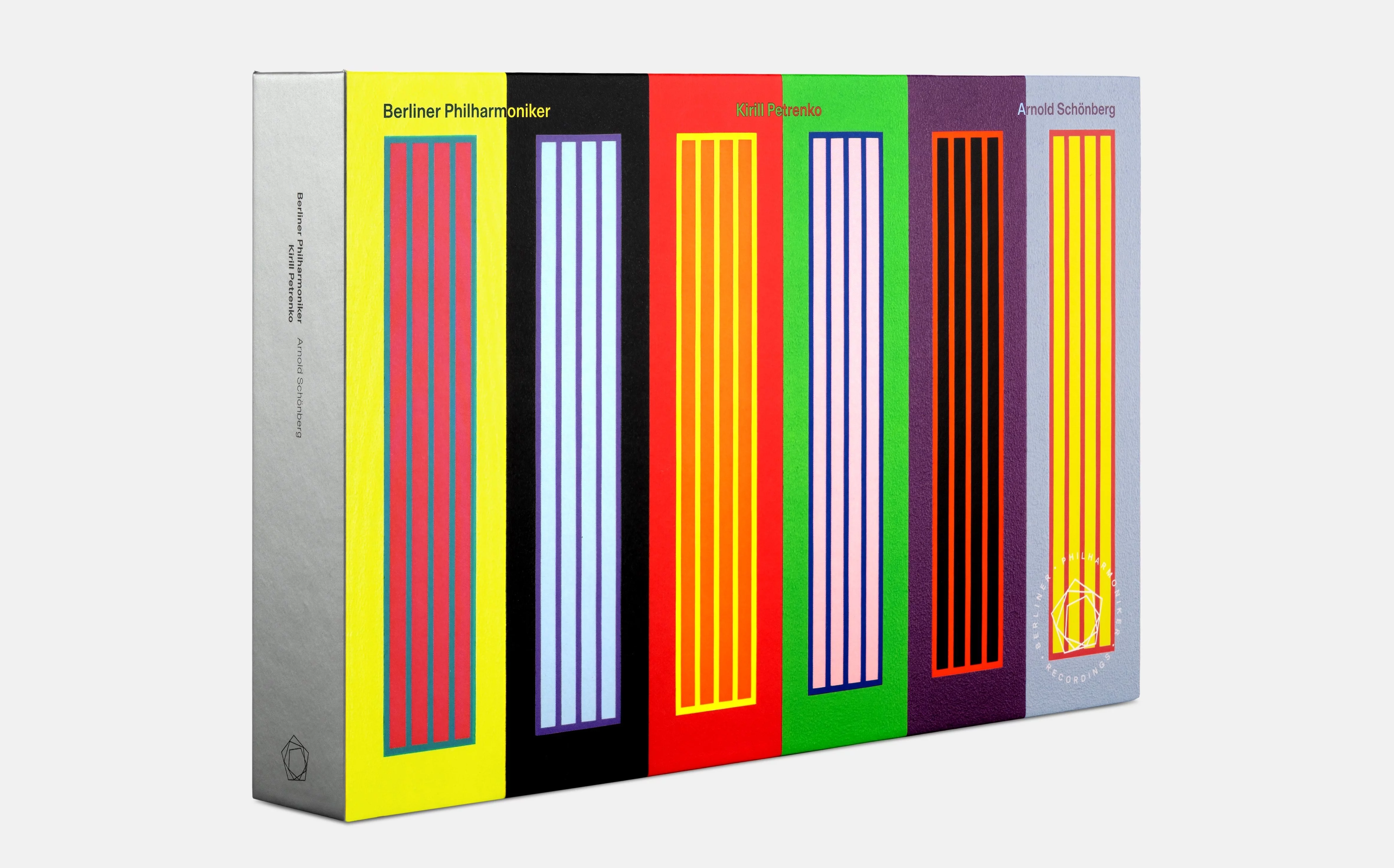A box set with colourful vertical stripes in yellow, red, green, black and purple.