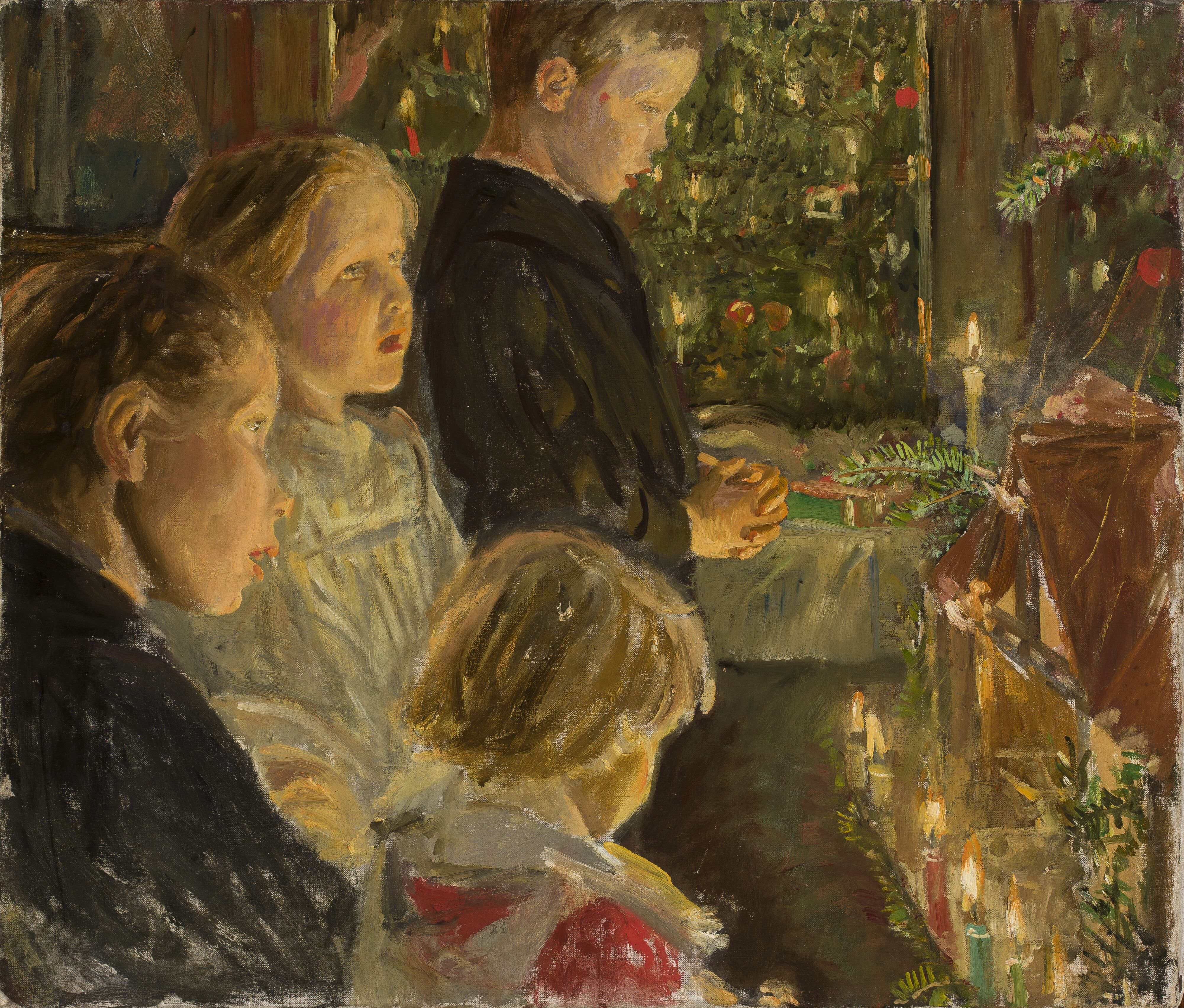 The painting shows four children standing devoutly in front of a festively decorated Christmas tree with lit candles. The scene is warmly lit and the children appear concentrated and solemn. A boy in dark clothing stands in the foreground with his hands folded, while the other children look attentively in the same direction.