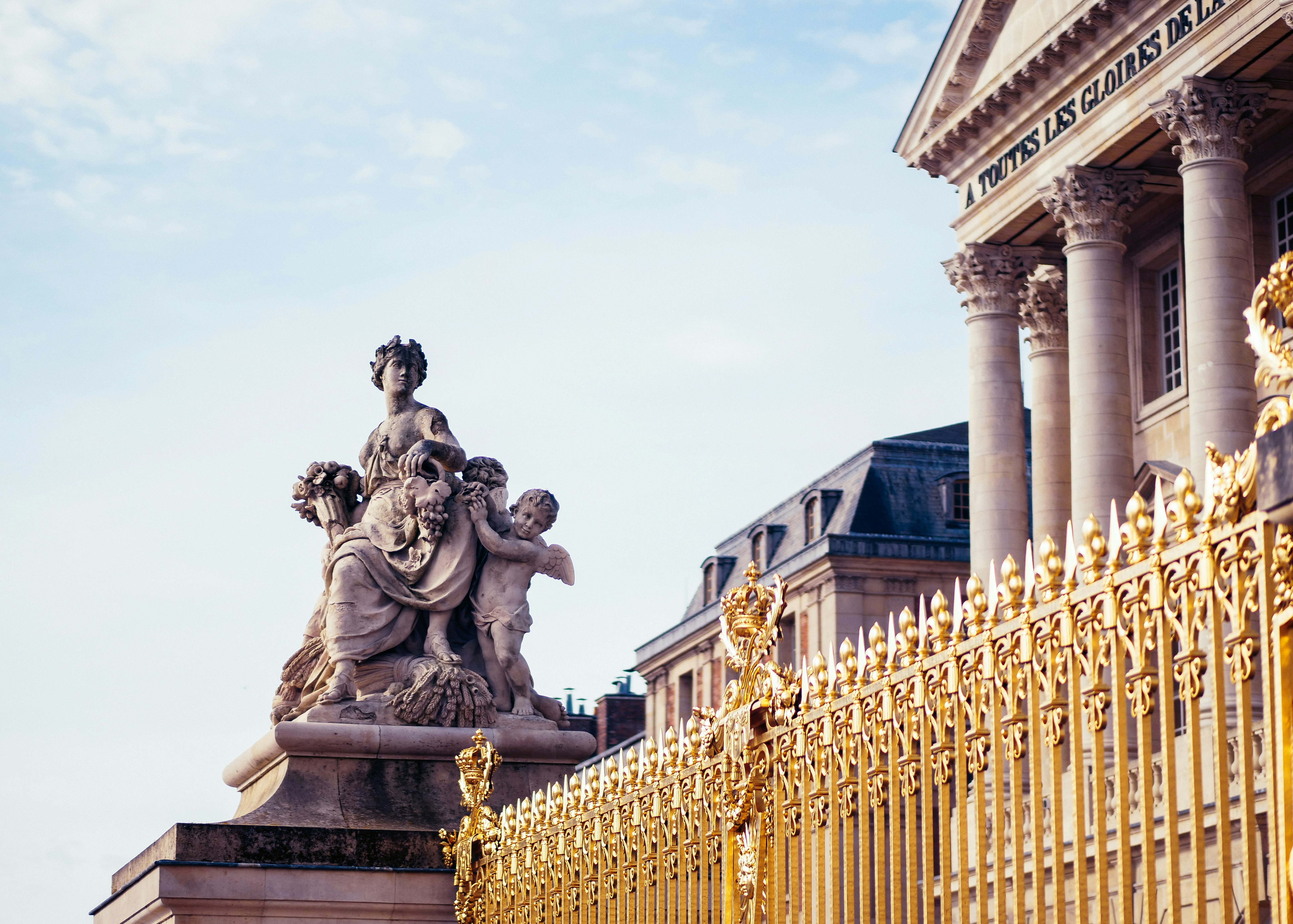 Golden fence, a statue and columns