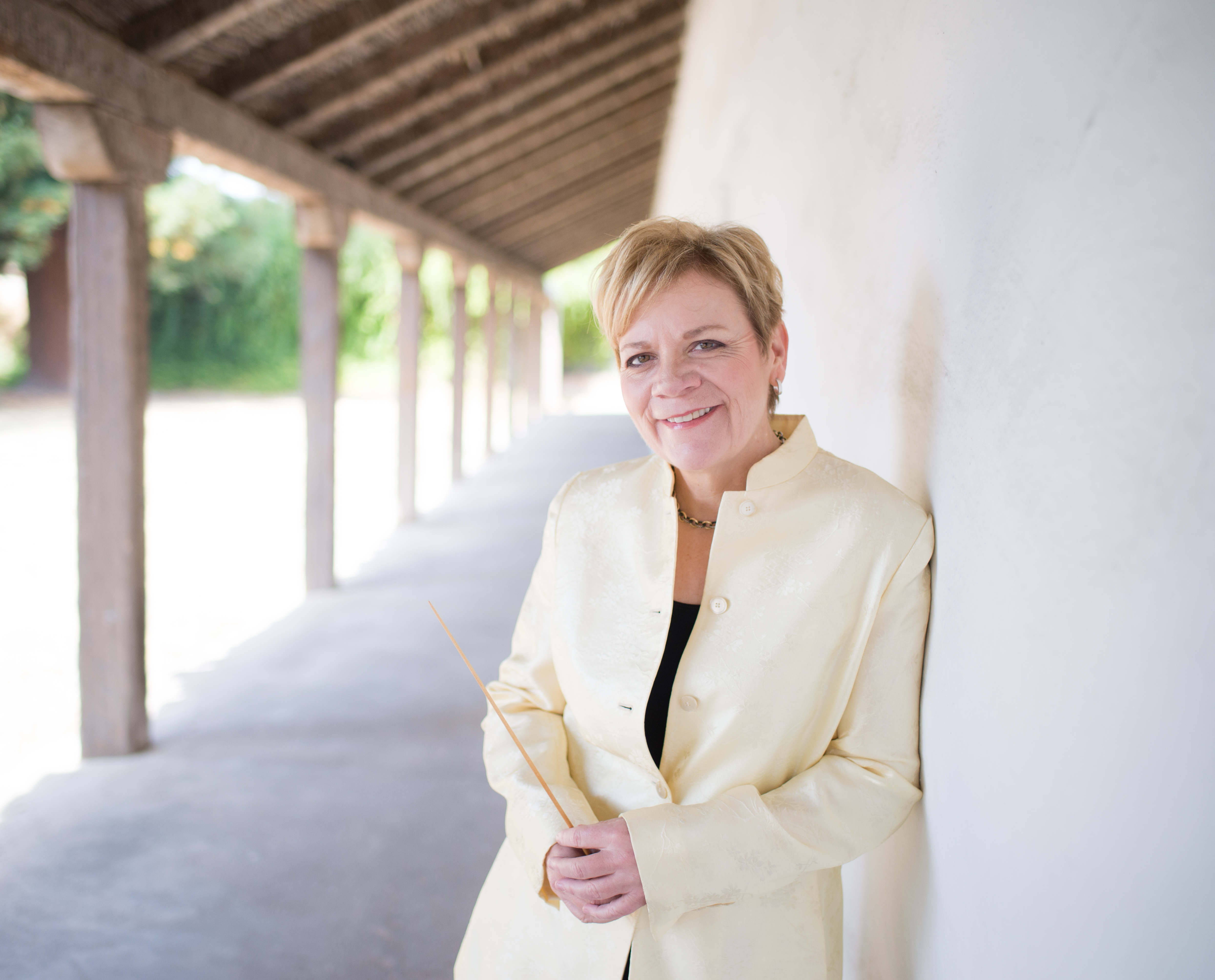 Marin Alsop leaning against a wall