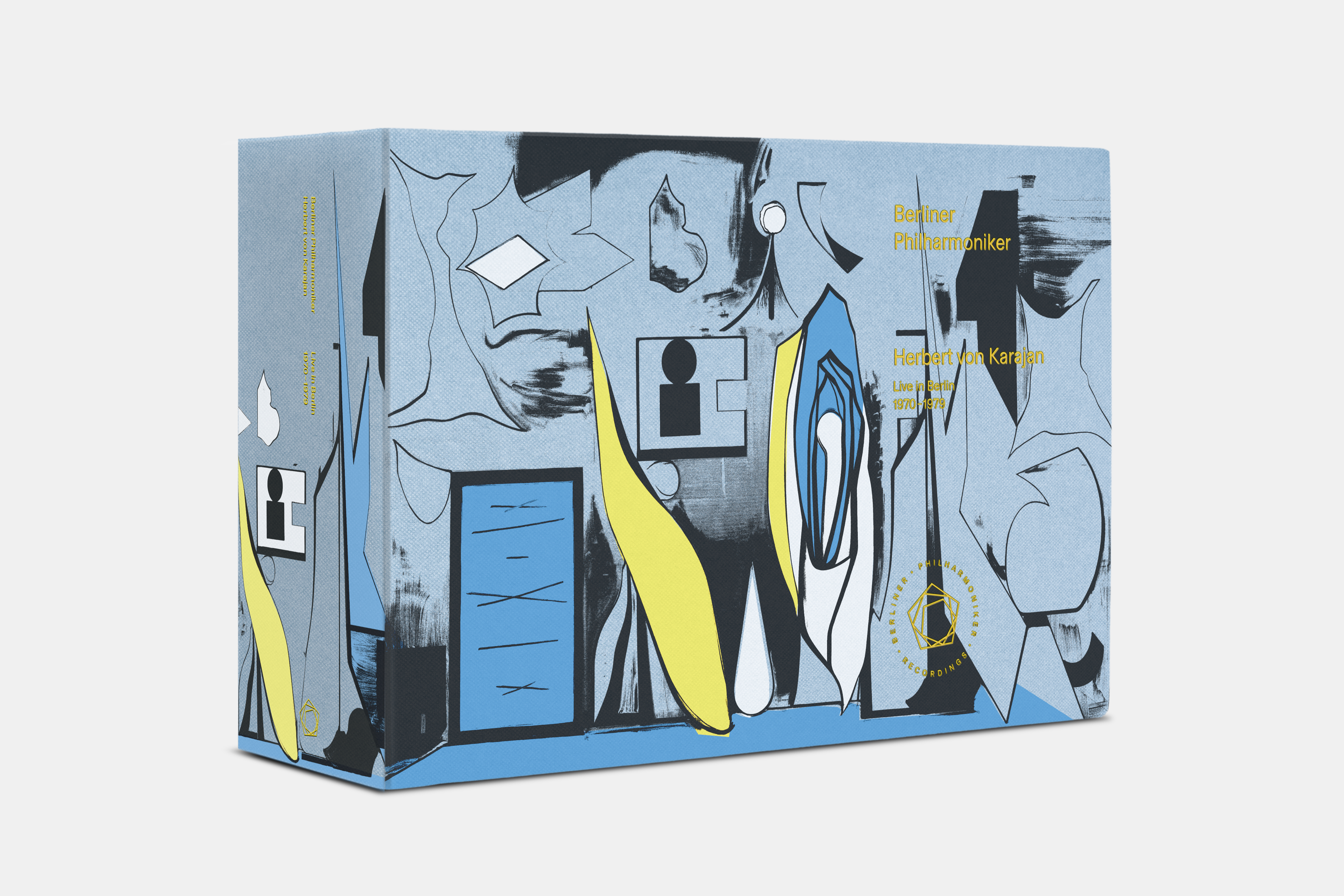 Eine Box mit abstrakten blauen, grauen, weißen und gelben Motiven, die geometrische und organische Formen zeigen. Der Text auf der Schachtel lautet: "Berliner Philharmoniker Herbert von Karajan Limited Edition".