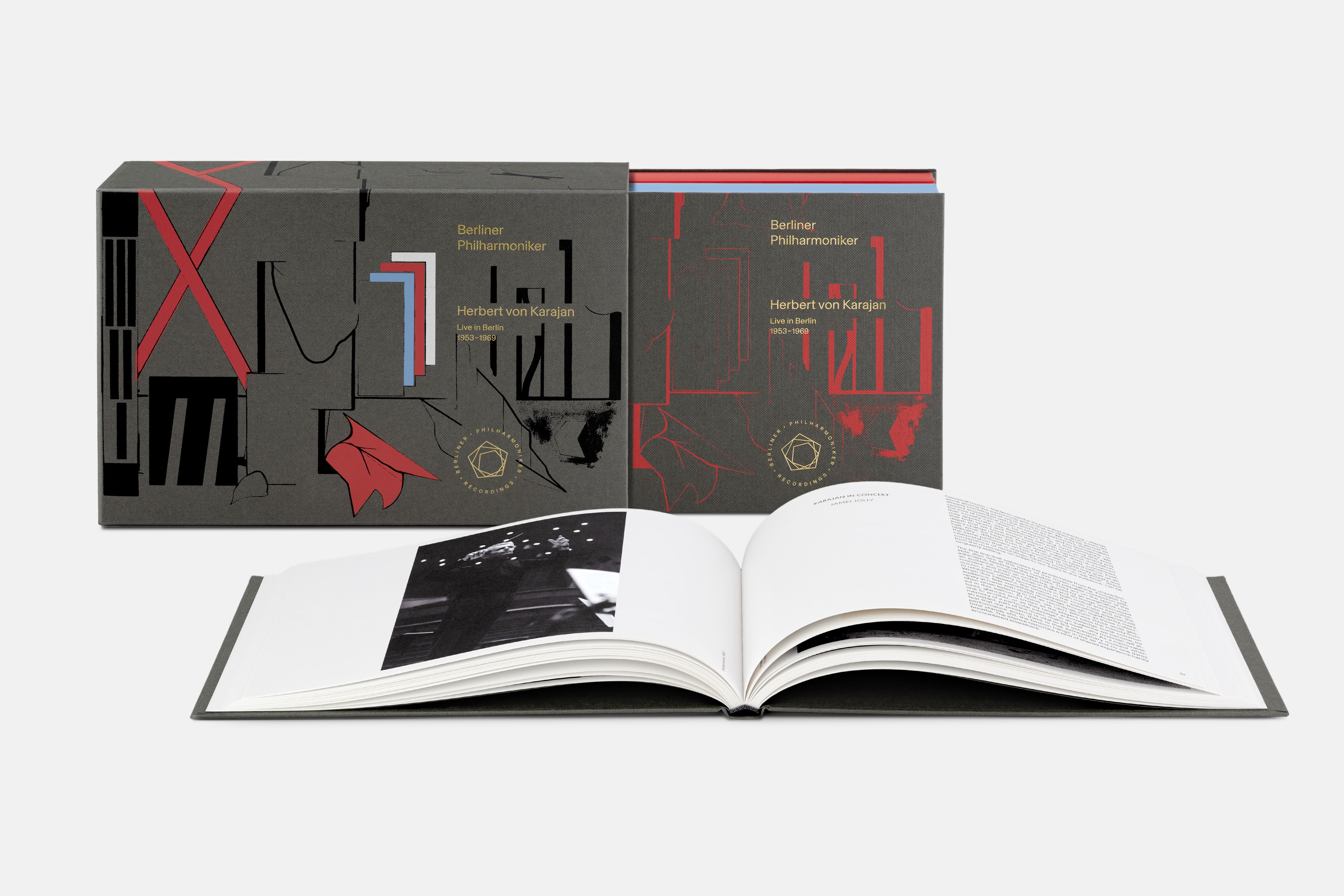 A high-quality CD box. It is elegantly designed in dark colours with gold lettering and contains several individual sleeves as well as an open book with texts and historical photographs. 
