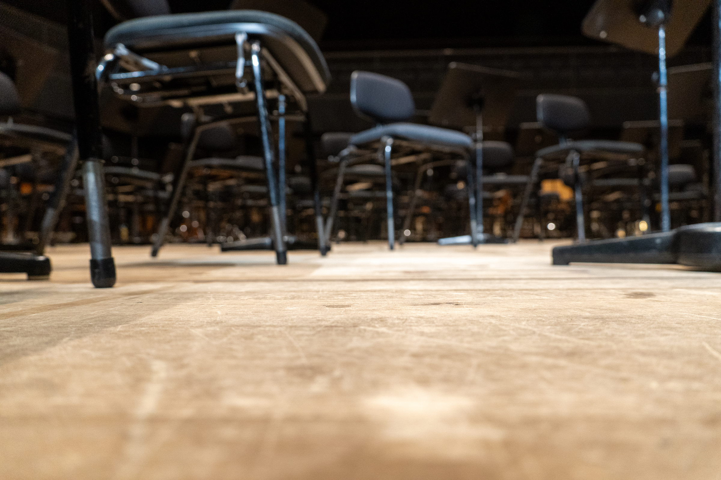 Stage floor and chairs.