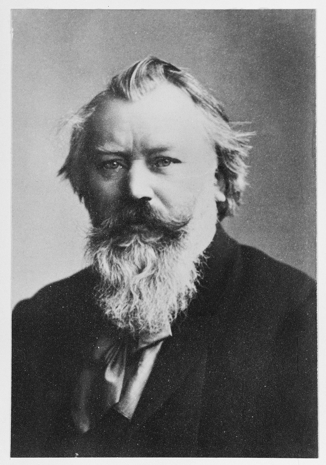Portrait photo of Johannes Brahms in black and white.